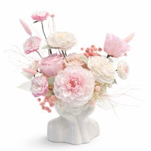 Powdered Dream preserved floral arrangement with blush pink and ivory roses in a sculptural ceramic vase